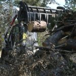 An Arkansas Baptist Disaster Relief team member moved debris near Hammond. Patrick Dennis photo