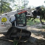 An Arkansas Baptist Disaster Relief team member moved debris near Hammond. Patrick Dennis photo