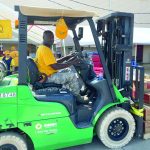 An Oklahoma Baptist Disaster Relief team member unloads boxes of food at Bayou Vista Baptist Church in Morgan City. Brian Blackwell photo