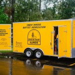 A trio from Illinois Baptist State Association Disaster Relief hauled a trailer from Three Rivers Baptist Association for recovery and cleanup work in Mandeville. TAB Media photo
