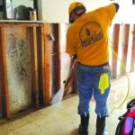 A Kansas-Nebraska Disaster Relief team member sprayed for mold inside a home impacted by Hurricane Ida.
