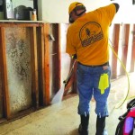 A Kansas-Nebraska Disaster Relief team member sprayed for mold inside a home impacted by Hurricane Ida.
