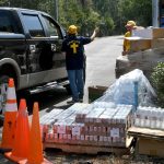 A Southern Baptist Disaster Relief chaplain talks with another team member at First Baptist Church in Mandeville. Patrick Dennis photo