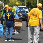 Missouri Baptist Disaster Relief team members distributed food to passengers who formed a line at First Baptist Church in Mandeville. Patrick Dennis photo