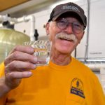 A Texas Baptist Disaster Relief team member proudly displayed a cup of cold water at New River Baptist Church in St. Amant. Patrick Dennis photo