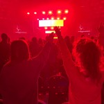 Youth Evangelism Celebration participants raise their hands during a time of worship.