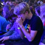 A student prayed during a session of the Youth Evangelism Celebration.