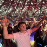 A student raised his hands in praise during a session of the 2021 Youth Evangelism Celebration.