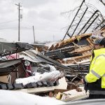 A worker surveyed damage in Bowling Green Feb. 10. Morgan Bass photo