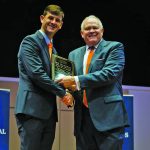 LCU President Rick Brewer presents an award to Ben McLaughlin.