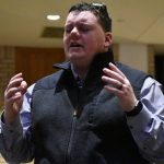 A pastor participates in a time of worship at the Pastors Conference.