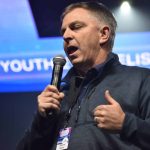 Louisiana Baptist Executive Director Steve Horn prays during a YEC session.