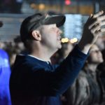 A student participates in a time of worship at YEC.