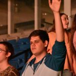 A student participates in a time of worship at YEC.