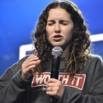 A student leads a prayer at YEC.