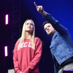 A student assists illusionist Jared Hall with a magic trick.