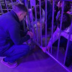 Louisiana Baptist Executive Director Steve Horn prays with Eli Wren, a student and son of Eddie Wren, pastor of First Baptist Church, Zachary.