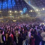 Shane Pruitt, National Next Gen Evangelism Director for the North American Mission Board, addresses students who came forward during a time of decision at YEC.