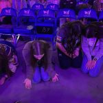 Students pray for their lost friends and other needs during the closing session of YEC.