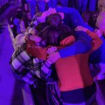 Students pray for their lost friends and other needs during the closing session of YEC.