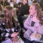 Students practice sharing the Gospel during a session of YEC.