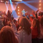 Students participate in a time of worship at YEC.