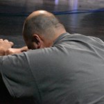 A man prayed at the altar at B-22 Auditorium, Dry Prong.