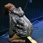 A young man prayed at the altar inside B-22 Auditorium, Dry Prong.