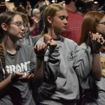 Students lifted their hands in prayer at the Big Creek Baptist Association Revival.