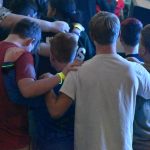 Students prayed in front of the stage during a time of decision for Christ at YEC.