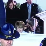 Louisiana Representative Gabe Firment and his wife Erica (top) bowed their heads during a prayer spoken during Gov. Jeff Landry's inauguration ceremony, Jan. 7, on the Capitol steps.