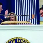 John Fleming stood with his wife Cindy as U.S. House Speaker Mike Johnson administered the oath of office to the newly elected state treasurer, Jan. 7.