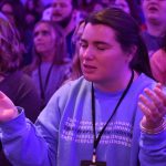 A student praised the Lord during a time of worship at CEC.