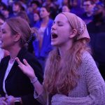 A student raised her hands toward heaven during a praise song at an LCU spring revival service.