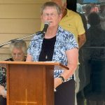 Mary Gore, director of Toledo Bend Baptist Resort Ministry, prayed at the dedication celebration for the ministry's new meeting facility.