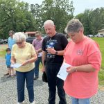 Supporters of Toledo Bend Baptist Resort Ministry prayed during a ceremony to dedicate the new meeting facility.