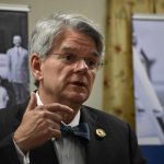 Louisiana Supreme Court Justice Jay McCallum shared the story of his family's ancestor, Jim Bowen, who first donated to the ministry in 1898. Bowen, who was 14 years old, donated a silver dollar after hearing a message from Cooksey.