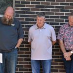 Jeremy Shepherd, pastor with Pineville Park Baptist Church, Pineville, Kevin Roberts, pastor with Trinity Baptist Church, Pineville, and Tim Hisaw, recently retired pastor with Tioga First Baptist Church, prayed with others during a community prayer event.