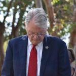 State Rep. Mike Johnson prayed during a community gathering outside the Rapides Parish School Board office.