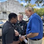 David Jeffreys, vice president with Louisiana Christian University (right), prayed with other members of the community during a prayer gathering for for students, teachers, families and the community.