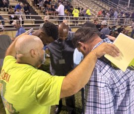 A decision counselor prayed with young men who made a decision during the West CENLA GO TELL AMERICA Crusade, April 12-15, 2026.