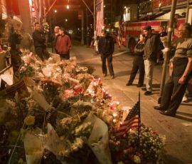 A New York fire. station becomes a makeshift memorial to the hundreds of firefighters who lost their lives when the Twin Towers collapsed. Photo by Morris Abernathy
