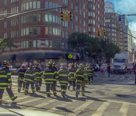 Firemen and rescue teams from nearby and distant cities make their way to the ruins of the World Trade Center. Photo by Jim Veneman